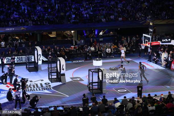 Victor Wembanyama of the San Antonio Spurs, Anthony Edwards of the Minnesota Timberwolves, and Paolo Banchero of the Orlando Magic compete in the Kia...