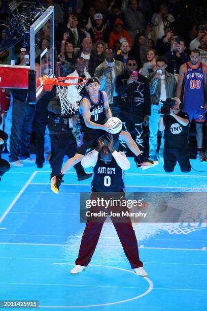Mac McClung of the G League, Osceola Magic dunks the ball over NBA Legend Shaquille O'Neal during the AT&T Slam Dunk as a part of State Farm All-Star...