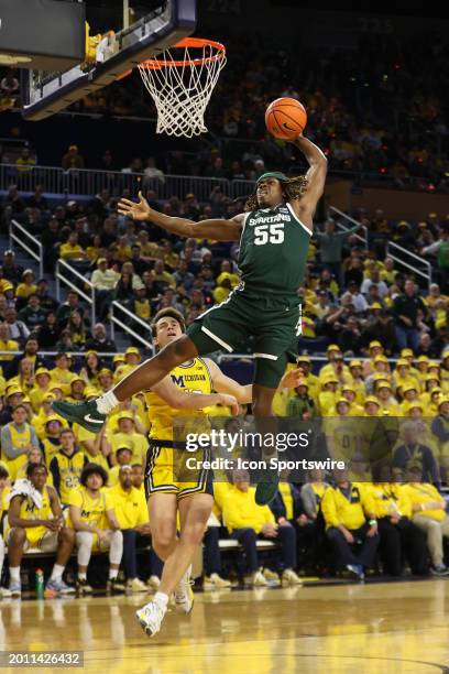 Michigan State Spartans forward Coen Carr goes up for a slam dunk during the first half of a regular season Big Ten Conference college basketball...