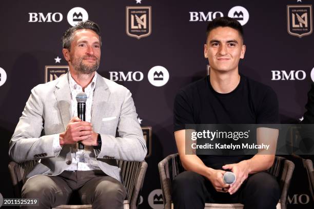 Los Angeles Football Club co-President and General Manager John Thorrington and midfielder Eduard Atuesta attend a news conference at...