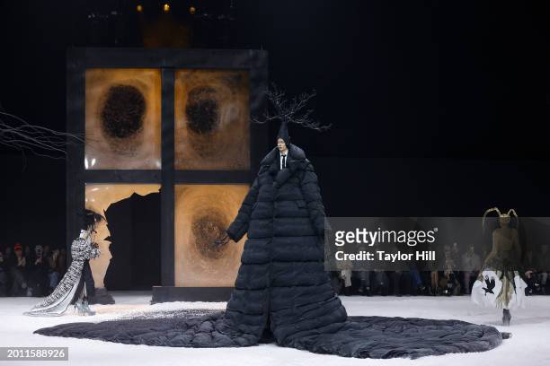 Anna Cleveland and Alex Consani walk the runway during the Thom Browne Fall 2024 fashion show to close New York Fashion Week at The Shed on February...