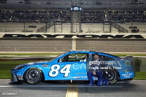 Jimmie Johnson, driver of the Carvana Toyota, poses for a photo on the grid during qualifying for the NASCAR Cup Series Daytona 500 at Daytona...