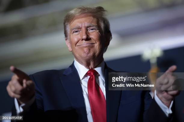 Republican presidential candidate, former U.S. President Donald Trump gestures to supporters after speaking at a Get Out The Vote rally at the North...