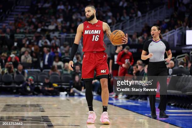 Caleb Martin of the Miami Heat handles the ball during a game against the Milwaukee Bucks at Fiserv Forum on February 13, 2024 in Milwaukee,...