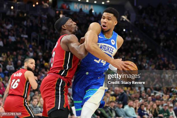 Giannis Antetokounmpo of the Milwaukee Bucks drives to the basket against Bam Adebayo of the Miami Heat during a game at Fiserv Forum on February 13,...