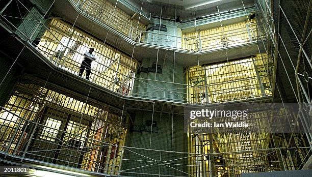 Prisoners at HMP Pentonville walk through an atrium May 19, 2003 in London. The Chief inspector of prisons Anne Owers will, in a report publishing...