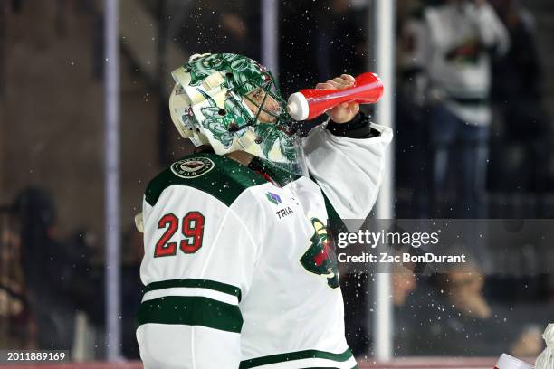 Marc-Andre Fleury of the Minnesota Wild during a timeout against the Arizona Coyotes during the second period at Mullett Arena on February 14, 2024...