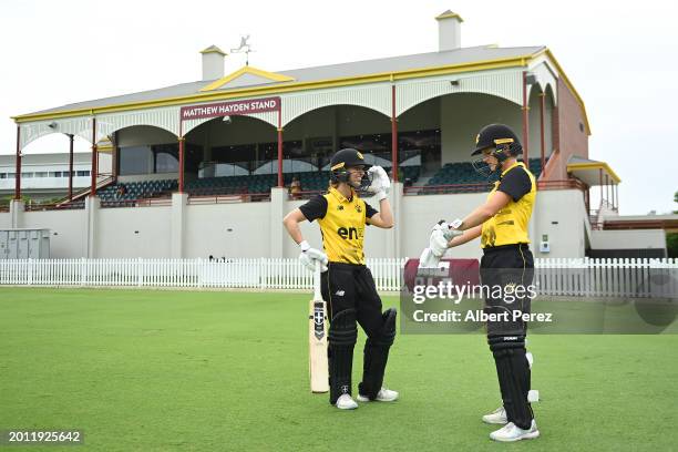 Chloe Piparo and Maddy Darke of Western Australia prepare to take to the field during the WNCL match between Queensland and Western Australia at...