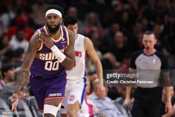 Royce O'Neale of the Phoenix Suns reacts to a three-point shot \during the second half of the NBA game against the Detroit Pistons at Footprint...