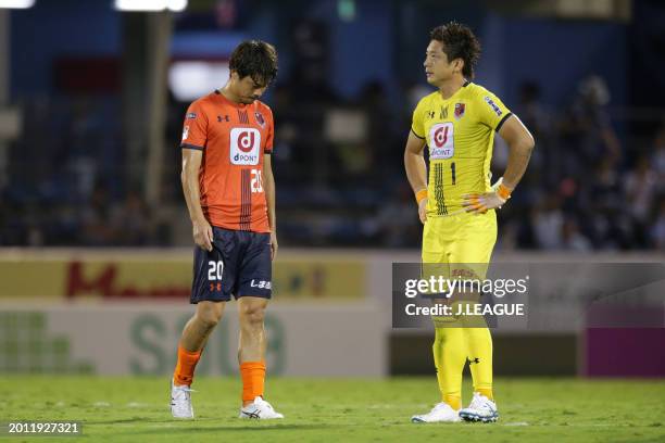 Tsubasa Oya and Nobuhiro Kato of Omiya Ardija look dejected after the team's 1-2 defeat in during the J.League J1 match between Júbilo Iwata and...