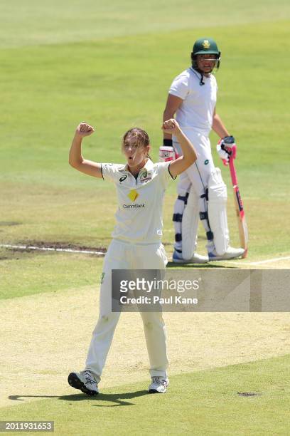 Annabel Sutherland of Australia celebrates the wicket of Tazmin Brits of South Africa during day one of the Women's Test Match between Australia and...