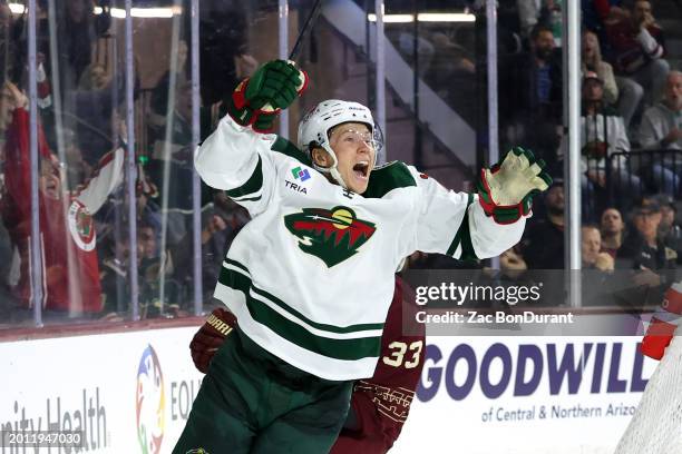 Matt Boldy of the Minnesota Wild celebrates after scoring a goal against the Arizona Coyotes during the third period at Mullett Arena on February 14,...