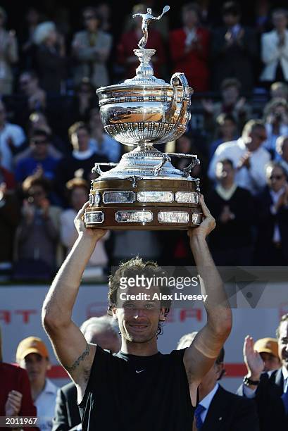 Carlos Moya of Spain lifts the trophy up after winning the Final of the ATP Seat Open held on April 27, 2003 at the Real Club de Tenis, in Barcelona,...