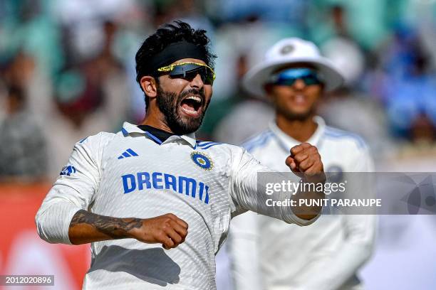India's Ravindra Jadeja celebrates after taking the wicket of England's Joe Root during the fourth day of the third Test cricket match between India...