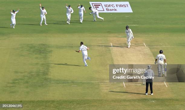 Mark Wood of England celebrates after dismissing Shubman Gill of India during day one of the 3rd Test Match between India and England at Saurashtra...