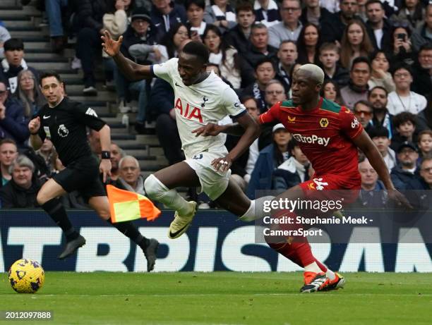 Tottenham Hotspur's Pape Matar Sarr is fouled by Wolverhampton Wanderers' Toti Gomes during the Premier League match between Tottenham Hotspur and...