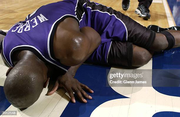 Chris Webber of the Sacramento Kings lays on the floor after sustaining a lateral meniscus tear in his left knee in Game two of the Western...