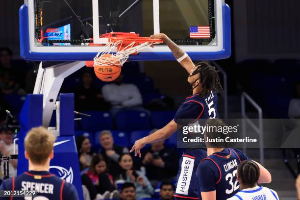 Stephon Castle of the Connecticut Huskies dunks the ball during the second half in the game against the DePaul Blue Demons at Wintrust Arena on...