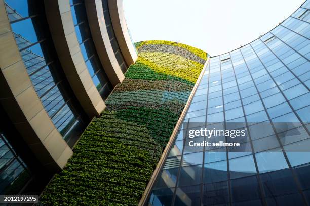 green walls for eco-friendly buildings - eco house stock pictures, royalty-free photos & images