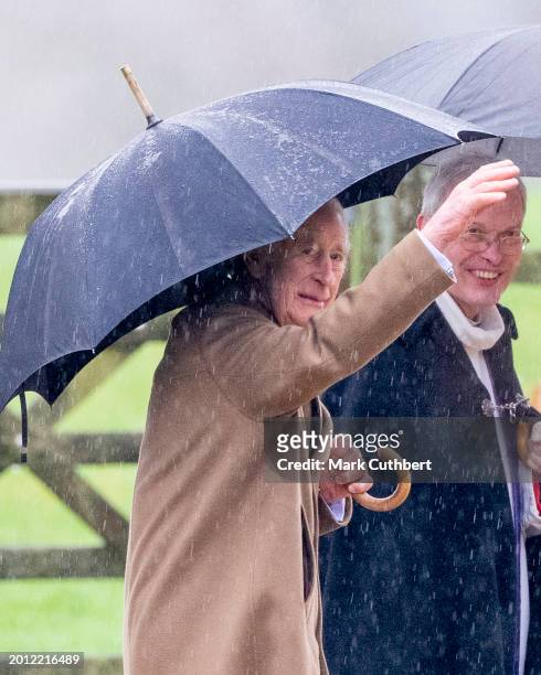 King Charles III accompanied by The Reverend Canon Dr Paul Williams, attend the Sunday service at the Church of St Mary Magdalene on the Sandringham...