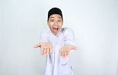 funny asian muslim man with surprised