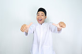 funny asian muslim man giving thumbs