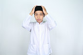 asian muslim man wearing kopiah skull