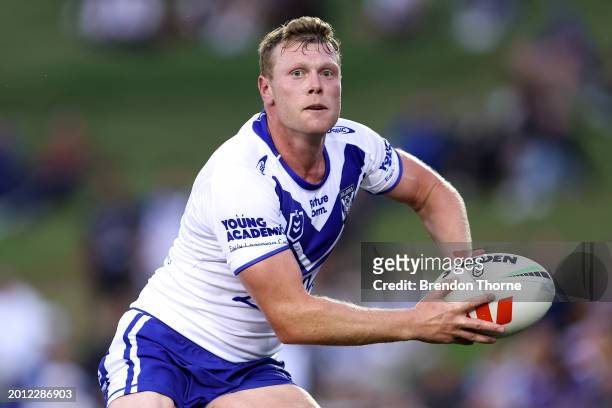 Drew Hutchison of the Bulldogs runs the ball during the NRL Pre-season challenge match between Canterbury Bulldogs and Melbourne Storm at Belmore...