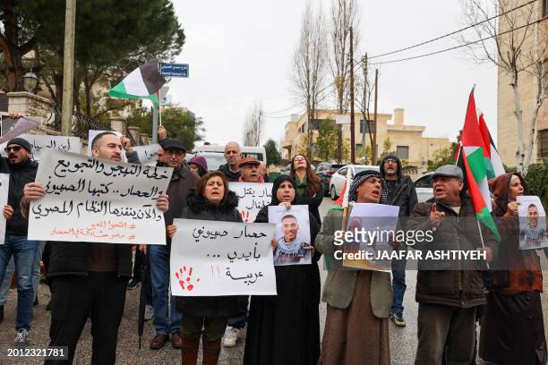 Palestinian protesters demonstrate outside the Egyptian diplomatic mission in Ramallah on February 18, 2024 to call on Egypt to open its border...