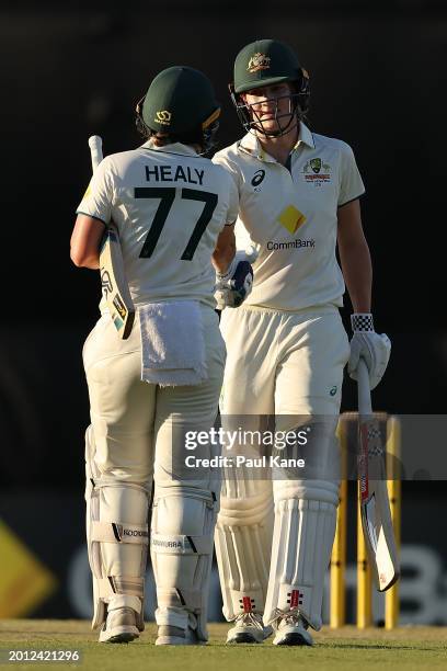 Annabel Sutherland of Australia celebrates her half century with Alyssa Healy during day one of the Women's Test Match between Australia and South...