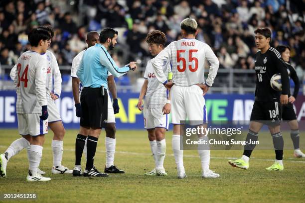 Ventforet Kofu players protest to referee Omar Mohamed Al-Ali after the penalty decision during the AFC Champions League Round of 16 first leg match...