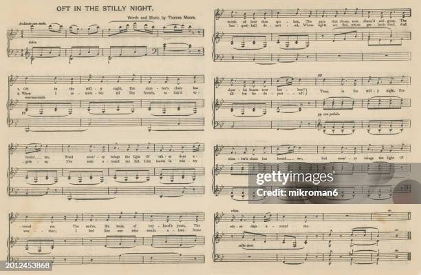 old engraved illustration of sheet music and lyrics of “oft in the stilly night” by thomas moore - the poem's melancholic tone conveys a sense of nostalgia and longing for a time that is gone forever - notenblatt stock-fotos und bilder