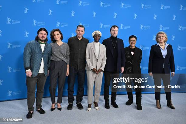 Members of the International Jury Brady Corbet, Jasmine Trinca, Christian Petzold, Lupita Nyong'o, Albert Serra, Ann Hui and Oksana Zabuzhko pose at...