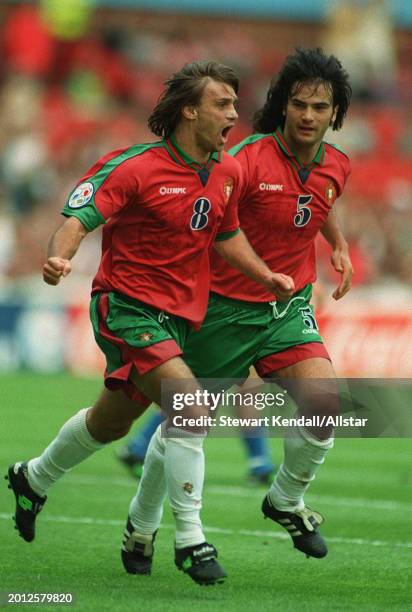 June 19: Joao Pinto of Portugal and Fernando Couto of Portugal celebrate during the UEFA Euro 1996 Group D match between Croatia and Portugal at City...