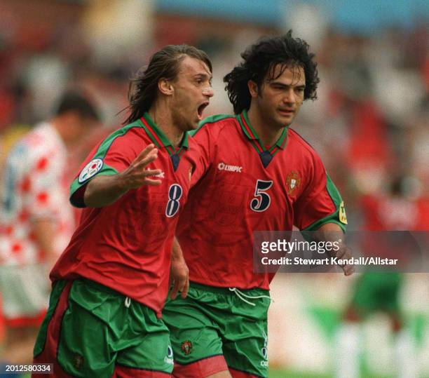 June 19: Joao Pinto of Portugal and Fernando Couto of Portugal celebrate during the UEFA Euro 1996 Group D match between Croatia and Portugal at City...
