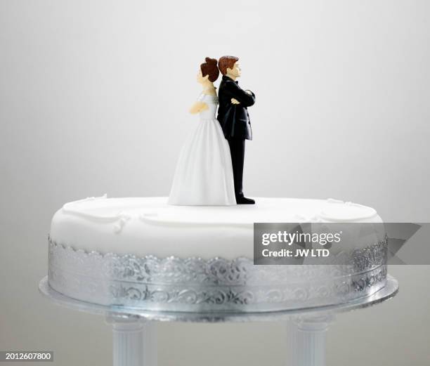 bride and bridegroom cake decoration on top of wedding cake, - mad bride stock pictures, royalty-free photos & images