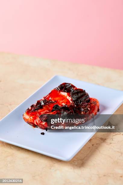 Cooked Red Pepper On White Plate High-Res Stock Photo