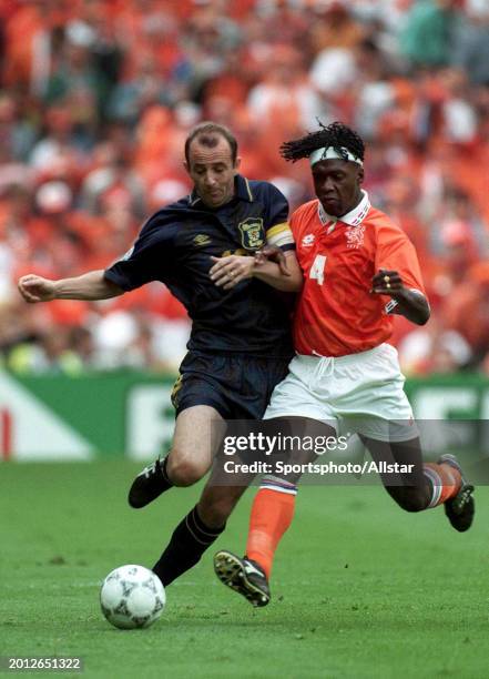 June 10: Gary Mcallister of Scotland and Clarence Seedorf of Holland challenge during the UEFA Euro 1996 Group A match between Holland and Scotland...