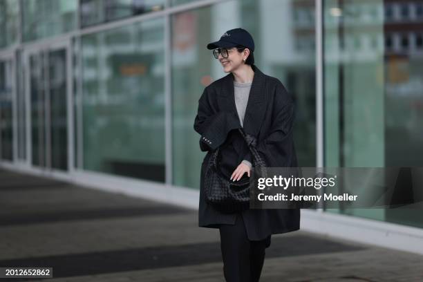 Maria Barteczko seen wearing Victoria Beckham black oversized aviator glasses, silver earrings, Frame x Ritz Paris dark blue logo baseball cap, Arket...