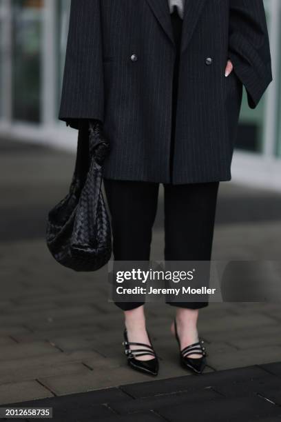 Maria Barteczko seen wearing VIVAL.STUDIO dark grey pinstripe oversized blazer jacket, Pixie Market black cigarette trousers / pants, Asos black...