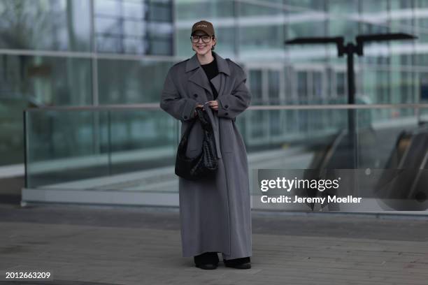 Maria Barteczko seen wearing Victoria Beckham black oversized aviator glasses, silver earrings, Celine brown logo baseball cap, Soft Goat black...