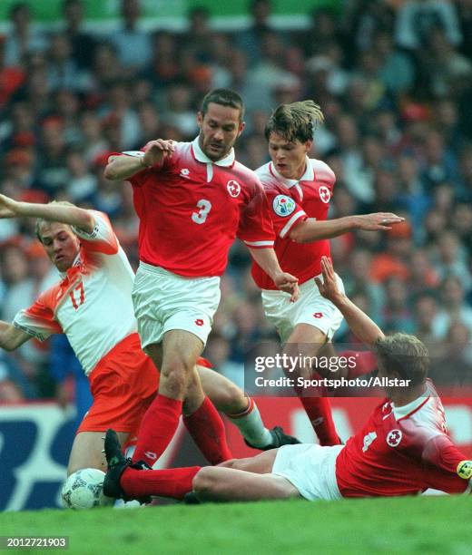 June 13: Yvan Quentin of Switzerland, Stephane Henchoz of Switzerland and Jordi Cruyff of Holland challenge during the UEFA Euro 1996 Group A match...