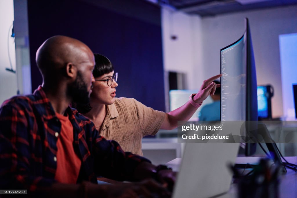 Creative developer, coding and team idea programming on computer in software or application development at office. 2 IT co-workers code on laptop or technology for testing, web design or online startup