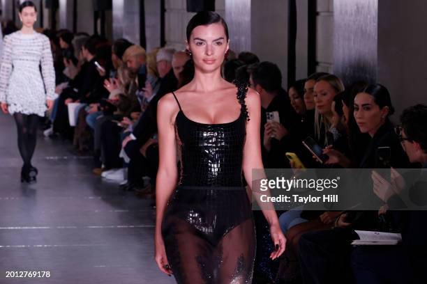 Emily Ratajkowski walks the runway at the Tory Burch A/W 2024 fashion show during New York Fashion Week at New York Public Library on February 12,...