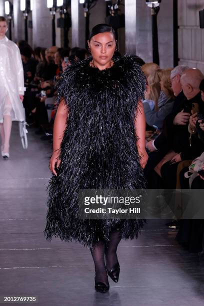 Paloma Elsesser walks the runway at the Tory Burch A/W 2024 fashion show during New York Fashion Week at New York Public Library on February 12, 2024...