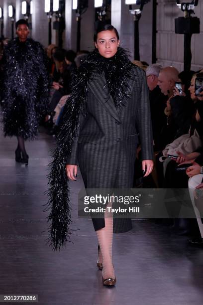 Model walks the runway at the Tory Burch A/W 2024 fashion show during New York Fashion Week at New York Public Library on February 12, 2024 in New...