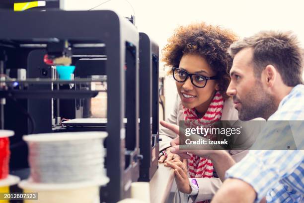 people in 3d printer office - electronic design engineer stock pictures, royalty-free photos & images