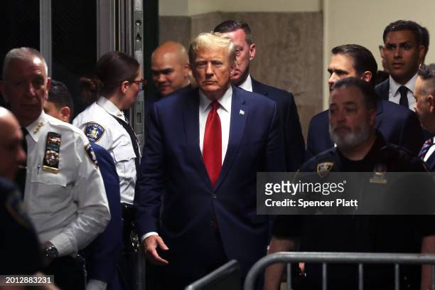 Former U.S. President Donald Trump arrives for a pre-trial hearing in a hush-money case at Manhattan Criminal Court on February 15, 2024 in New York...