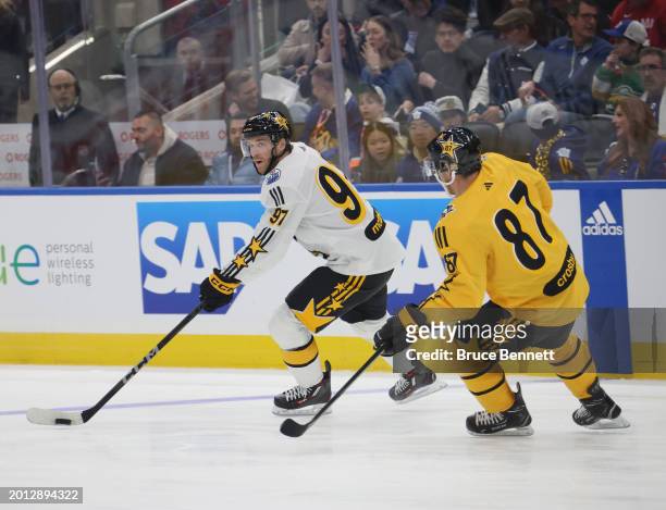 Connor McDavid of the Edmonton Oilers skates against Sidney Crosby of the Pittsburgh Penguins during the 2024 NHL All-Star Game on February 03, 2024...