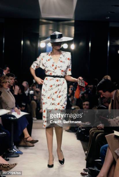 Model wearing a dress with the word 'love' printed on it, from Chanel's collection for spring and summer, Paris, January 30th 1979.